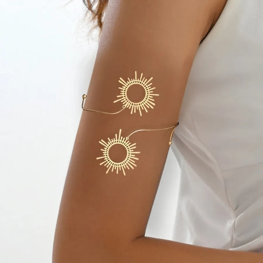 Sun motif arm cuff bangle, gold